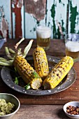 Barbecued corn cobs with parmesan