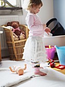 Little girl in child's bedroom