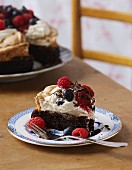 Brownie cake with cream and berries