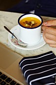 Creamy vegetable soup in a mug