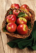 Several Braeburn apples in a basket