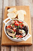 Herring salad with prunes, raisins and marinated peppers