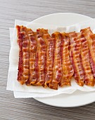 Cooked Bacon Resting on a Plate with Paper Towels