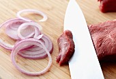 Sliced Raw Beef and Red Onions