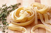 Fresh Thyme and Uncooked Pasta Nests