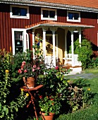 Red, Swedish wooden house with large porch