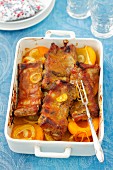 Baked pork ribs with onions, curry powder and peaches