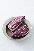 Two quarters of red cabbage on a plate