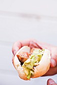 Sausage with Mashed Avocado on a Roll