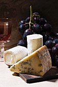 Blue cheese and goat's cheese with grapes and red wine