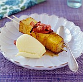Grilled pineapple skewer with vanilla ice cream