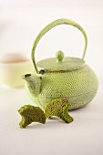 An arrangement featuring a teapot and matcha biscuits