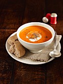 Squash soup with ground black pepper and sour cream