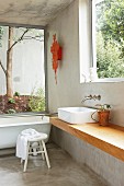 Purist bathroom with large windows in concrete house