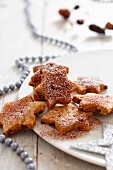 Star-shaped biscuits with cinnamon and icing sugar for Christmas