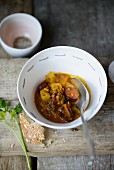 Lentil curry with pineapple and sausage
