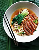 Duck breast with egg noodles and pak choi (Asia)