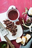 Sliced beef steak with cranberry sauce for Christmas