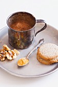 Cocoa, Walnuts, Gold Dust and Shortbread Cookies on a Silver Plate