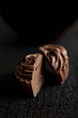 A chocolate praline, cut in half