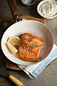 Fried salmon fillet with dill and lemon