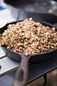 Cooked quinoa in a cast iron pan