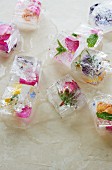 Ice cubes containing a variety of edible flowers