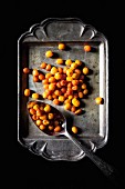 Sea buckthorn berries on an old metal tray (view from above)