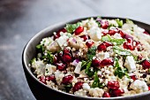 Couscous salad with pomegranate seeds, feta and mint