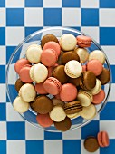 Lots of different macaroons in a glass bowl