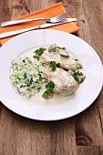 Corn-fed spring chicken breast in a creamy mushroom sauce with parsley and rice