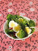 Spinach salad with egg hearts and chives