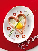 A sausage heart with a fried egg for Valentine's Day