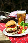Cheeseburger with tomatoes and beer