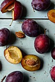 Plums, whole and halved