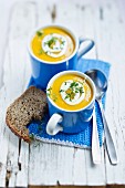 Carrot soup with sour cream and cress