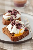 Toast topped with poached eggs and red wine sauce