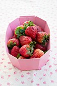 Fresh strawberries in a paper bowl