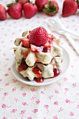 Waffles with white chocolate glaze and strawberries