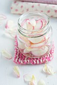 Rose petals in a jar on a pan holder