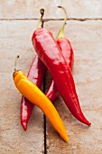 Cayenne chilli peppers on a stone surface