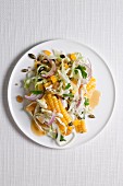 Cabbage and sweetcorn salad with raisins and pumpkin seeds