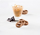 Chocolate pretzels and a cold caffè latte over ice