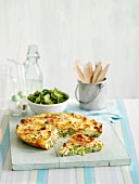 Frittata with peas, partly sliced