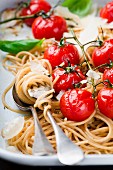 Whole wheat spaghetti with cherry tomatoes and parmesan (close up)