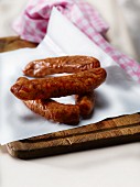 French smoked sausages on wax paper