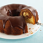 Marble cake with chocolate glaze, partly sliced