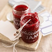 Raspberry-vanilla marmalade in a jar with a spoon