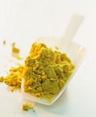 Mustard powder on a plastic scoop