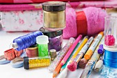 Still life assortment of hobby craft, knitting, painting, drawing and sewing accessories